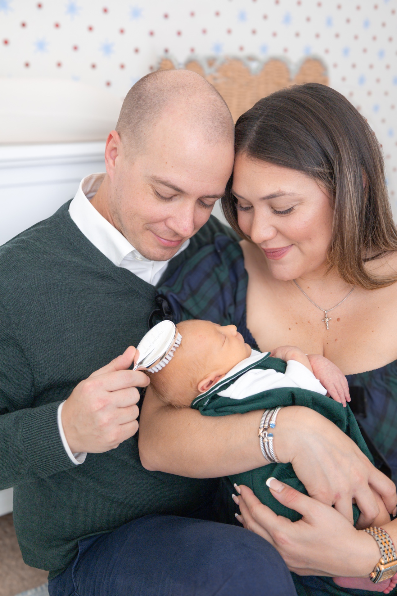 New parents cradling their baby